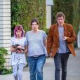 Exclusif - Milla Jovovich enceinte se promène avec son mari Paul W. S. Anderson et leur fille Ever dans les rues de Beverly Hills le 7 janvier 2020.