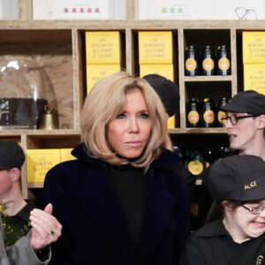 Sophie Cluzel, secrétaire d'état chargée des personnes handicapées - Le président Emmanuel Macron et sa femme Brigitte lors de l'inauguration du Café Joyeux, le cinquième, sur l'avenue des Champs-Elysée à Paris le 9 mars 2020.© Stéphane Lemouton / Bestimage