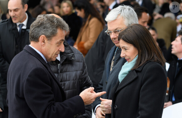 Nicolas Sarkozy, Didier Reynders commissaire européen à la justice, Anne Hidalgo, maire de Paris lors de la cérémonie à l'occasion de la première journée nationale d'hommage aux victimes du terrorisme sur l'Esplanade du Trocadero à Paris le 11 mars 2020. © Jacques Witt / Pool / Bestimage