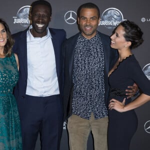 Omar Sy et sa femme Hélène Sy (boucles d'oreilles Messika), Tony Parker et sa femme Axelle Francine - Première du film "Jurassic World" à l'Ugc Normandie à Paris le 29 mai 2015.