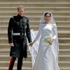 Meghan Markle le jour de son mariage avec le prince Harry le 19 mai 2018 à Windsor. Sa robe de mariée sur-mesure signée Givenchy est estimée à 225 000 euros.