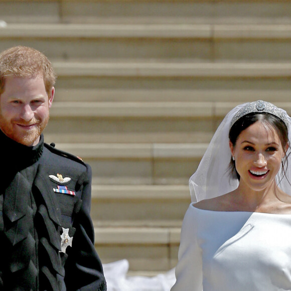 Meghan Markle le jour de son mariage avec le prince Harry le 19 mai 2018 à Windsor. Sa robe de mariée sur-mesure signée Givenchy est estimée à 225 000 euros.