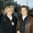  Marie-Anne Chazel et Christian Clavier - Messe d'anniversaire pour Jean-Luc Lagardère à Paris. Le 16 mars 2004. 