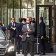Exclusif - Le Président français Emmanuel Macron, met son masque à la sortie de son hôtel bruxellois avant de se rendre au Sommet européen à Bruxelles. Belgique, Bruxelles, 18 juillet 2020.