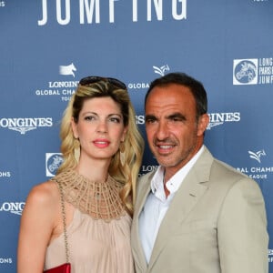 Exclusif - Nikos Aliagas et sa compagne Tina Grigoriou - Photocall lors du Longines Paris Eiffel Jumping au Champ de Mars à Paris, le 7 juillet 2018. © Perusseau-Veeren/Bestimage  !