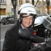 François Hollande en scooter à Paris.