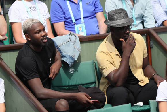 Lilian Thuram et son fils Marcus Thuram - People dans les tribunes lors des Internationaux de France de Tennis de Roland-Garros à Paris le 2 juin 2018. © Dominique Jacovides-Cyril Moreau / Bestimage 