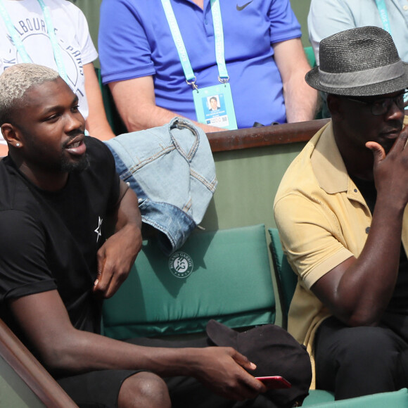 Lilian Thuram et son fils Marcus Thuram - People dans les tribunes lors des Internationaux de France de Tennis de Roland-Garros à Paris le 2 juin 2018. © Dominique Jacovides-Cyril Moreau / Bestimage 