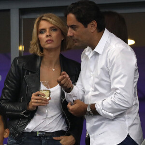 Sylvie Tellier (directrice générale de la Société Miss France et Miss France 2002) et son mari Laurent dans les tribunes du stade de France lors du match de ligue des nations opposant la France à l'Allemagne à Saint-Denis, Seine Saint-Denis, France, le 16 octobre 2018.