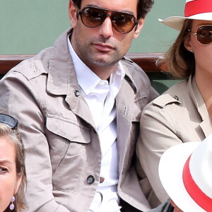 Sylvie Tellier et son compagnon Laurent - Jour 7 - People aux Internationaux de France de tennis a Roland Garros a Paris le 2 juin 2013.