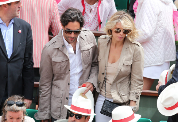 Sylvie Tellier et son compagnon Laurent - Jour 7 - People aux Internationaux de France de tennis a Roland Garros a Paris le 2 juin 2013.