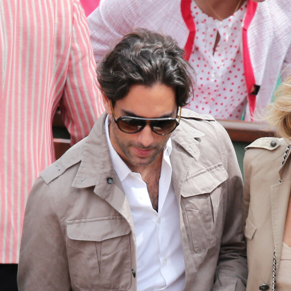Sylvie Tellier et son compagnon Laurent - Jour 7 - People aux Internationaux de France de tennis a Roland Garros a Paris le 2 juin 2013.