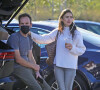 Exclusif - Lily Collins et son fiancé Charlie McDowell prennent un café près de leur voiture puis font un passage à un centre de recyclage à Los Angeles le 13 janvier 2021 