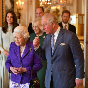 La reine Elizabeth II et son fils le prince Charles, avec Kate Middleton, le prince William, le prince Harry et Meghan Markle (enceinte) - La famille royale d'Angleterre lors de la réception pour les 50 ans de l'investiture du prince de Galles au palais Buckingham à Londres.
