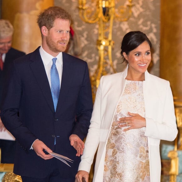 Le prince Harry, duc de Sussex, et Meghan Markle (enceinte), duchesse de Sussex - La famille royale d'Angleterre lors de la réception pour les 50 ans de l'investiture du prince de Galles au palais Buckingham à Londres.