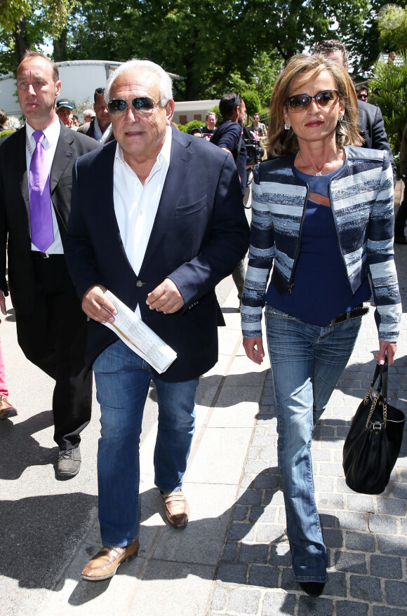 Dominique Strauss Kahn et sa compagne Myriam L'Aouffir aux Internationaux de France de tennis de Roland Garros le 30 mai 2015.