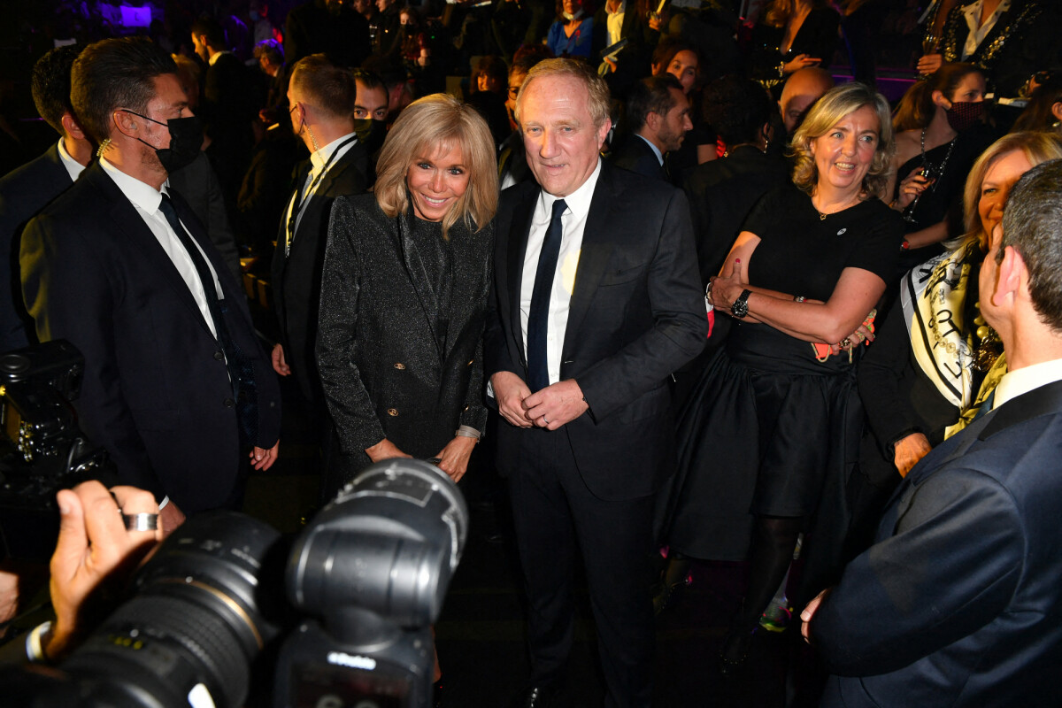 Photo Brigitte Macron, FrançoisHenri Pinault au défilé "Love Brings