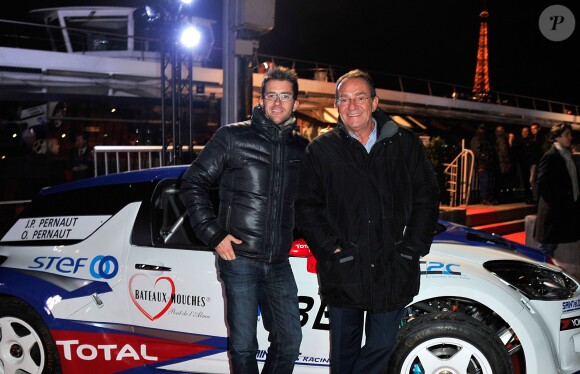 Jean-Pierre Pernaut et son fils Olivier posent devant leur Citroen C4 lors de la conference de presse de la 25eme edition du Trophee Andros a Paris le 27 novembre 2013.