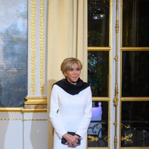 Emmanuel Macron, president de la République francaise, sa femme Brigitte Macron - Dîner des chefs d'Etats et de Gouvernements, des chefs des Organisations internationales, des acteurs du numérique ainsi que des partenaires du Forum au palais de l'Elysée à Paris. Le 11 novembre 2021