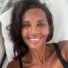 Karine Le Marchand : Rare cliché avec sa fille Alya, tendrement allongée sur ses genoux