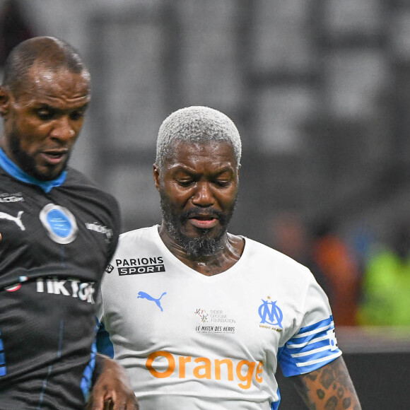 Eric Abidal, Djibril Cissé - Match des héros entre l'équipe OM Legends et l'équipe UNICEF au stade Orange Velodrome à Marseille le 13 octobre 2021. © Jean-René Santini/Bestimage