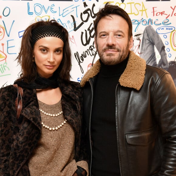Exclusif - Samuel Le Bihan et sa nouvelle compagne Stefania Cristian - People lors de la présentation de la collection capsule de la maison Lanvin "Poetry in Motion", une nouvelle ligne jeune "surfer", à la boutique Lanvin à Paris. © Veeren / Bestimage