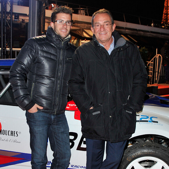 Jean-Pierre Pernaut et son fils Olivier posent devant leur Citroen C4 lors de la conference de presse de la 25eme edition du Trophee Andros a Paris le 27 novembre 2013.