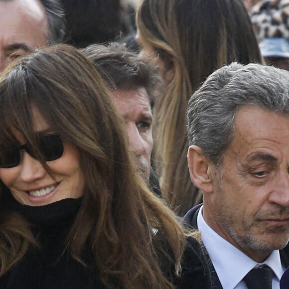 Nicolas Sarkozy et sa femme Carla Bruni-Sarkozy - Obsèques de Jean-Pierre Pernaut en la Basilique Sainte-Clotilde à Paris le 9 mars 2022. © Denis Guignebourg/ Bestimage