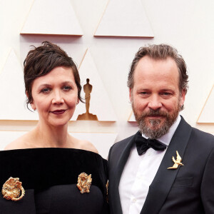 Maggie Gyllenhaal et son mari Peter Sarsgaard - 94e édition de la cérémonie des Oscars à Los Angeles, le 27 mars 2022.