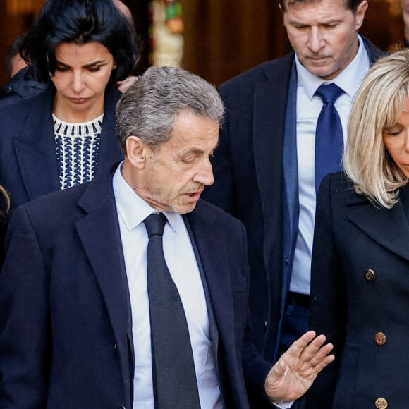 Carla Bruni, Nicolas Sarkozy, Brigitte Macron - Sorties des obsèques de Jean-Pierre Pernaut en la Basilique Sainte-Clotilde à Paris le 9 mars 2022