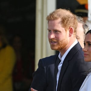 Le prince Harry, duc de Sussex, et Meghan Markle, duchesse de Sussex assistent à un engagement à la veille des Jeux Invictus 2020 aux Pays-Bas, à La Haye, le 15 avril 2022. 