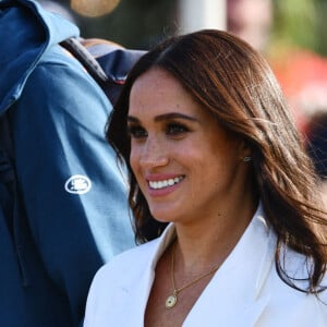 Le prince Harry, duc de Sussex, et Meghan Markle, duchesse de Sussex assistent à un engagement à la veille des Jeux Invictus 2020 aux Pays-Bas, à La Haye, le 15 avril 2022. 