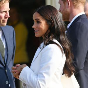 Le prince Harry, duc de Sussex, et Meghan Markle, duchesse de Sussex assistent à un engagement à la veille des Jeux Invictus 2020 aux Pays-Bas, à La Haye, le 15 avril 2022. 