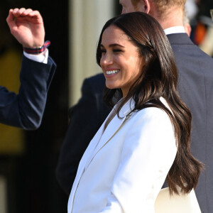 Le prince Harry, duc de Sussex, et Meghan Markle, duchesse de Sussex assistent à un engagement à la veille des Jeux Invictus 2020 aux Pays-Bas, à La Haye, le 15 avril 2022. 