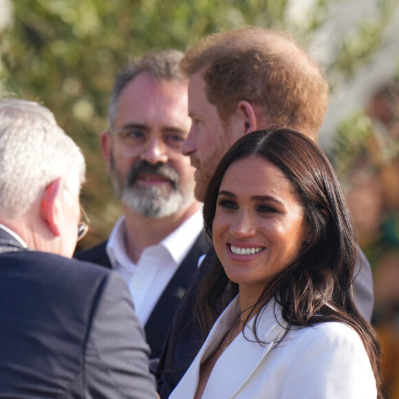 Le prince Harry, duc de Sussex, et Meghan Markle, duchesse de Sussex assistent à un engagement à la veille des Jeux Invictus 2020 aux Pays-Bas, à La Haye, le 15 avril 2022. 