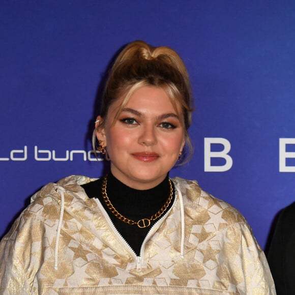 Louane et son compagnon Florian Rossi - Avant Première de " Belle " film animé japonais au Grand Rex à Paris le 6 décembre 2021 . © Veeren / Bestimage 