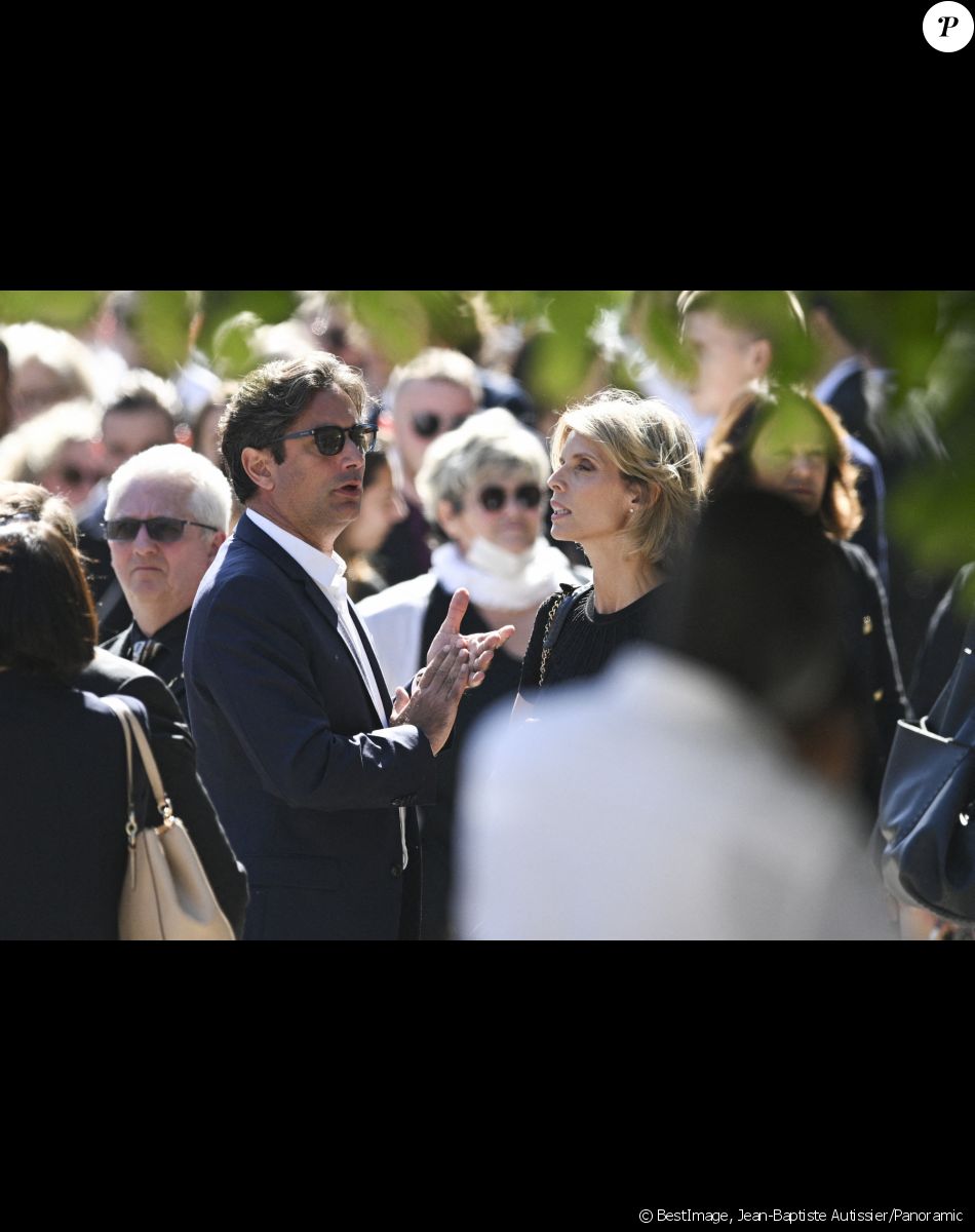Sylvie Tellier et son mari Laurent - Sortie des obsèques d'Antoine Alléno (fils du chef cuisinier français, trois étoiles au Guide Michelin Yannick Alléno) en la collégiale Notre-Dame de Poissy, France, le 13 mai 2022. © Jean-Baptiste Autissier/Panoramic/Bestimage