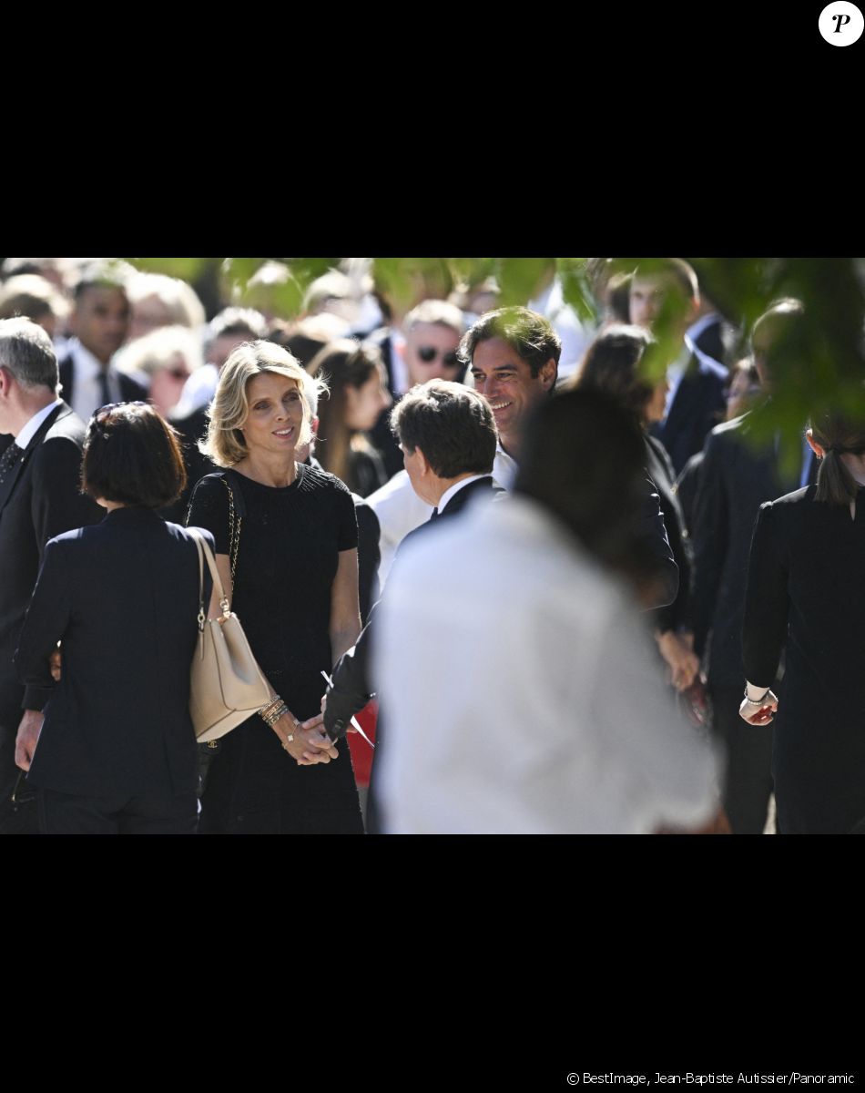 Sylvie Tellier et son mari Laurent - Sortie des obsèques d'Antoine Alléno (fils du chef cuisinier français, trois étoiles au Guide Michelin Yannick Alléno) en la collégiale Notre-Dame de Poissy, France, le 13 mai 2022. © Jean-Baptiste Autissier/Panoramic/Bestimage