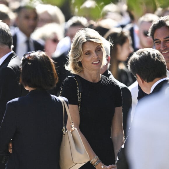 Sylvie Tellier et son mari Laurent - Sortie des obsèques d'Antoine Alléno (fils du chef cuisinier français, trois étoiles au Guide Michelin Yannick Alléno) en la collégiale Notre-Dame de Poissy, France, le 13 mai 2022. © Jean-Baptiste Autissier/Panoramic/Bestimage