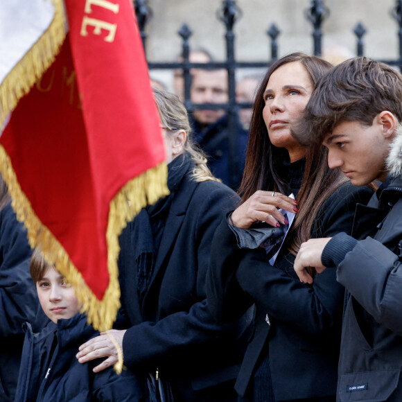 Nathalie Marquay et son fils Tom - La famille de Jean-Pierre Pernaut à la sortie des obsèques en la Basilique Sainte-Clotilde à Paris le 9 mars 2022. © Cyril Moreau/Bestimage
