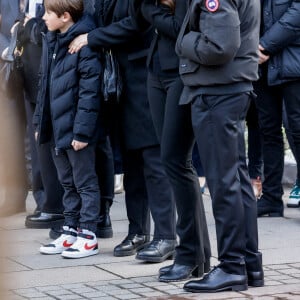 Nathalie Marquay et son fils Tom - La famille de Jean-Pierre Pernaut à la sortie des obsèques en la Basilique Sainte-Clotilde à Paris le 9 mars 2022. © Cyril Moreau/Bestimage