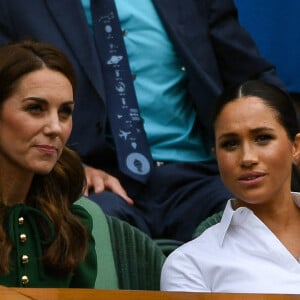 Archives - Catherine (Kate) Middleton, duchesse de Cambridge, Meghan Markle, duchesse de Sussex, sont dans les tribunes lors de la finale femme de Wimbledon "Serena Williams - Simona Halep (2/6 - 2/6) à Londres le 13 juillet 2019. © Chryslène Caillaud / Panoramic / Bestimage 