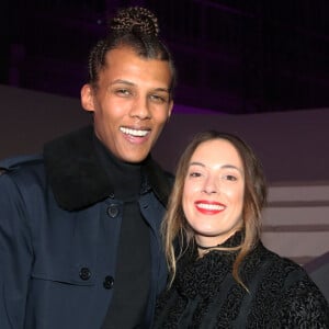 Info - Sortie le 4 mars de "Multitude" nouvel album de Stromae - Stromae (nouvelle coupe de cheveux) et sa femme Coralie Barbier au défilé "Victoria's Secret Paris 2016" au Grand Palais à Paris. © Denis Guignebourg/Bestimage 