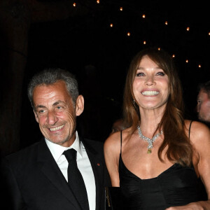 Carla Bruni et son mari Nicolas Sarkozy à la soirée "Women In Motion" par Kering au Château de la Castre lors du 75ème Festival International du Film de Cannes, le 22 mai 2022.  Gala Woman in Motion Kering during Cannes Film Festival. May 22nd, 2022.