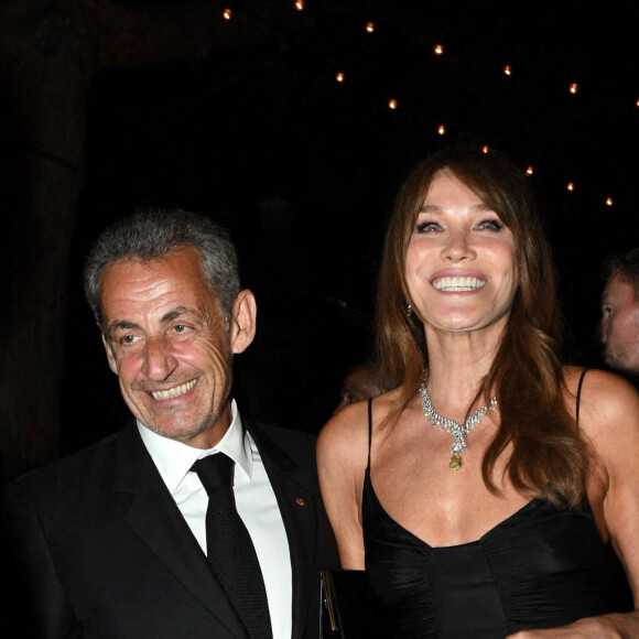 Carla Bruni et son mari Nicolas Sarkozy à la soirée "Women In Motion" par Kering au Château de la Castre lors du 75ème Festival International du Film de Cannes, le 22 mai 2022. 