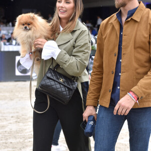 Camille Cerf (Miss France 2015 et Ambassadrice du LGCT-LPEJ 2022), son compagnon Théo Fleury et le chien Romeo - 8ème édition du "Longines Paris Eiffel Jumping" au Champ de Mars à Paris, le 25 juin 2022. © Perusseau/Gorassini/Tribeca/Bestimage