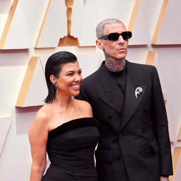 Kourtney Kardashian et Travis Barker lors de la 94ème édition de la cérémonie des Oscars au théâtre Dolby, à Los Angeles, Californie, Etats-Unis, le 27 mars 2022. 