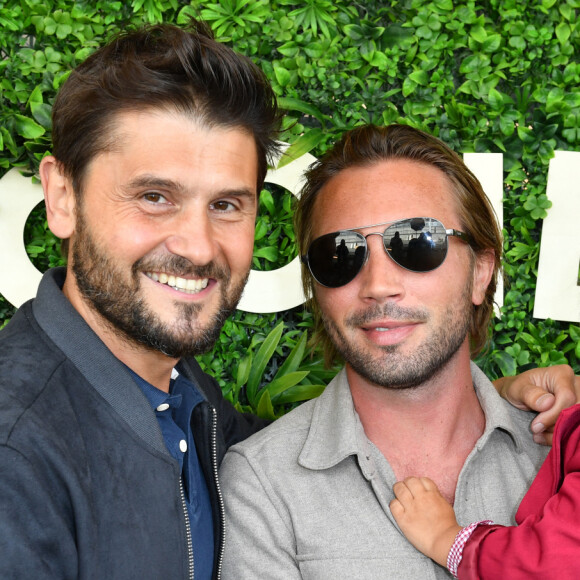 Christophe Beaugrand, son mari Ghislain Gerin et leur fils Valentin - 5 ans de la marque Joone, sur la péniche La Barge à Issy-les-Moulineaux. Paris, le 30 juin 2022. © Veeren / Bestimage