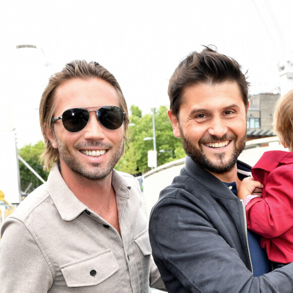 Christophe Beaugrand, son mari Ghislain Gerin et leur fils Valentin - 5 ans de la marque Joone, sur la péniche La Barge à Issy-les-Moulineaux. Paris, le 30 juin 2022. © Veeren / Bestimage