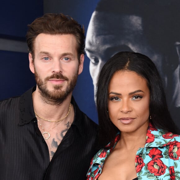 Christina Milian et son mari Matt Pokora au photocall de la première du film "Ambulance" à Los Angeles le 4 avril 2022.